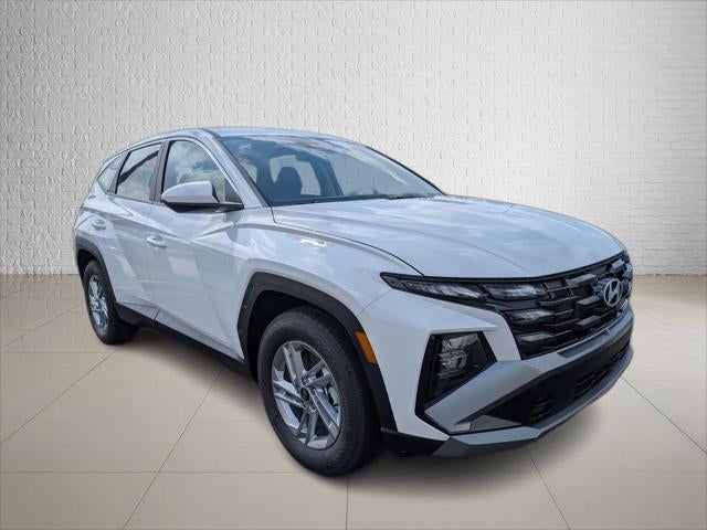 2026 Hyundai TUCSON SE FWD in Serenity White Pearl — front three-quarter view